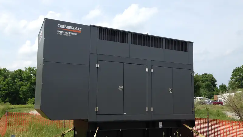 A large enclosed backup generator installed outdoors